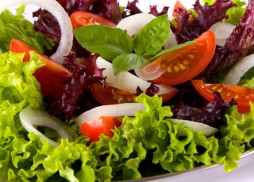 A Blend of romaine and iceberg with shaved carrots and red cabbage, topped with their own signature ingredients and served with dressing on the side